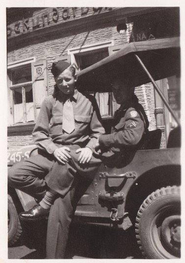 Vintage two army soldiers sitting on vehicle black and white illustration.