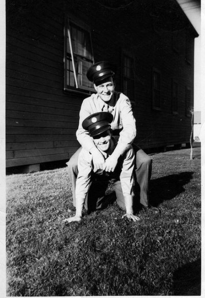 Vintage two army soldiers smiling black and white illustration.