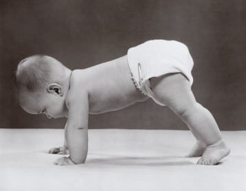 babypushups vintage baby in diaper on hands and feet crawling