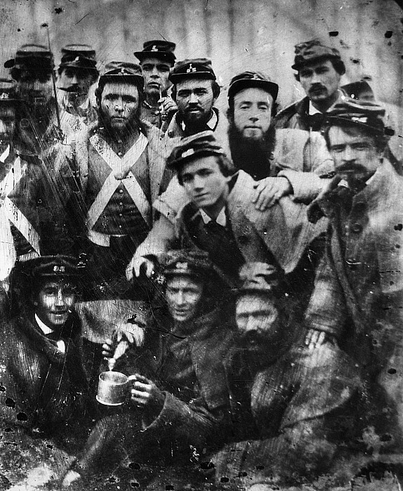 Group of confederate soldiers looking at camera.