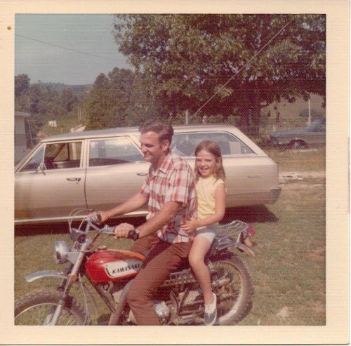 Vintage uncle with niece riding motorcycle 1970s. 