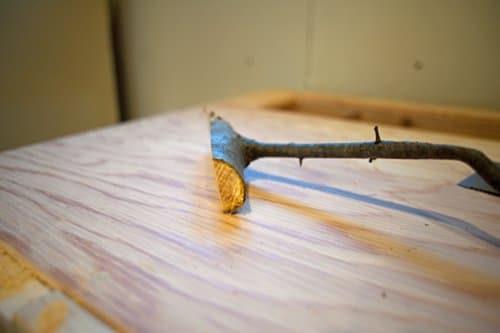 diy homemade coat hook from tree branch stick is cut