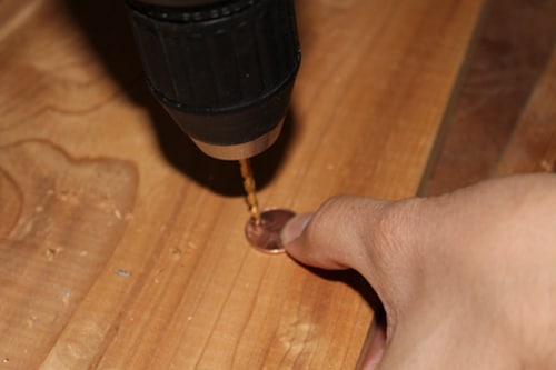 drilling hole in penny for diy charm bracelet
