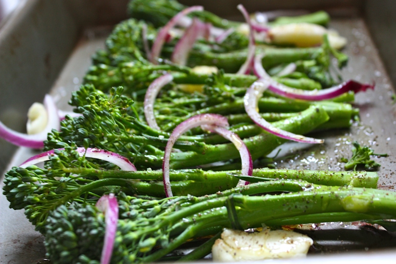 Roasted broccolini with red onion garlic salt pepper.