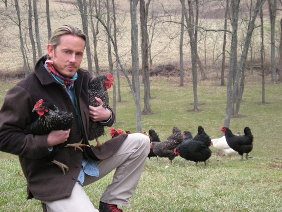 Creek Stewart with chickens raising backyard hens.