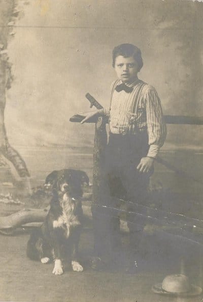 Jack London in 1885, at age 9. posing with dog