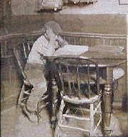 Young Jack London studying the dictionary at J.M. Heinold's Saloon
