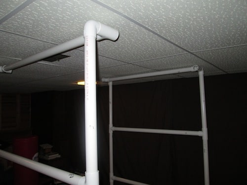 Step 18: Insert your last 4 foot PVC pipe sections into the open middle T section holes.