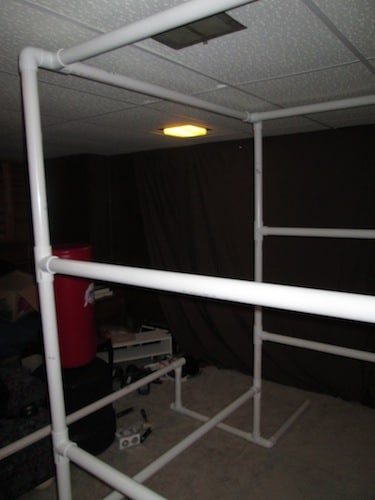 Step 19: Insert your 4 foot 3 inch section into the open T section holes above the parallel bars.