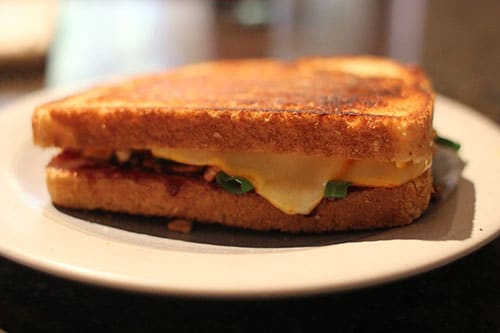 Grilled cheese sandwich with green onion raspberry jam.