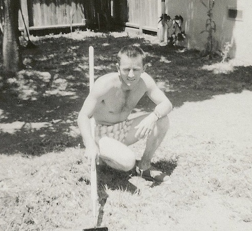 Vintage man with garden working on lawn yard. 