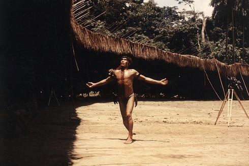 Vintage man standing and open his arms.