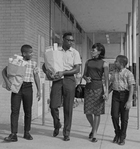 vintage african american black family walking out of grocery store shopping