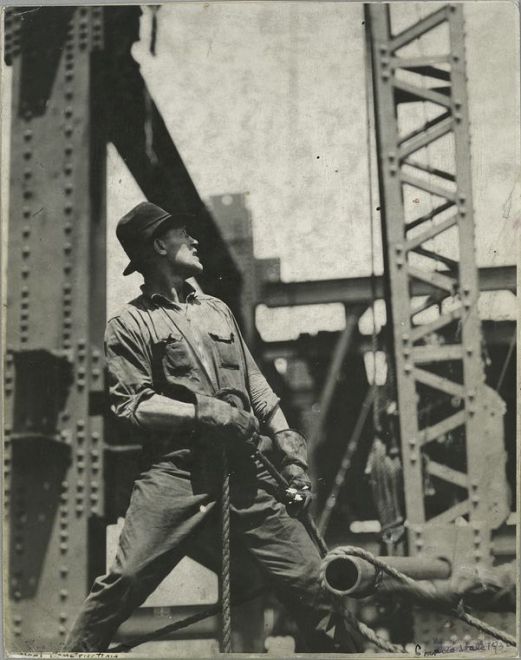 Vintage blue collar steel worker on construction site.