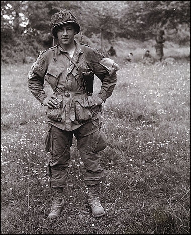 Forrest Guth world war ii soldier posing full uniform in field.