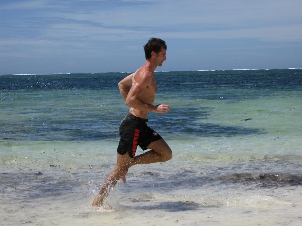 Vintage man running the side of ocean.