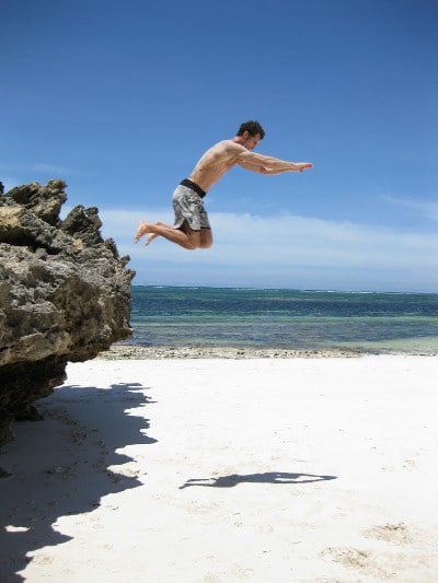 Vintage man jumping in the water.