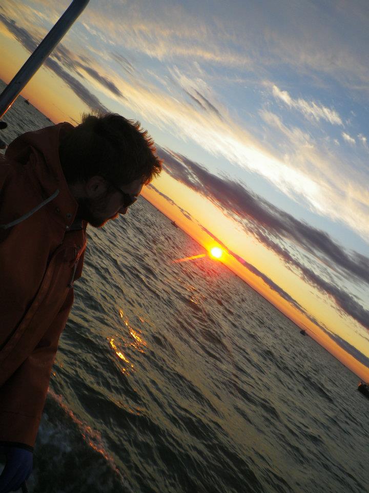 Vintage fisherman on boat closeup photo.