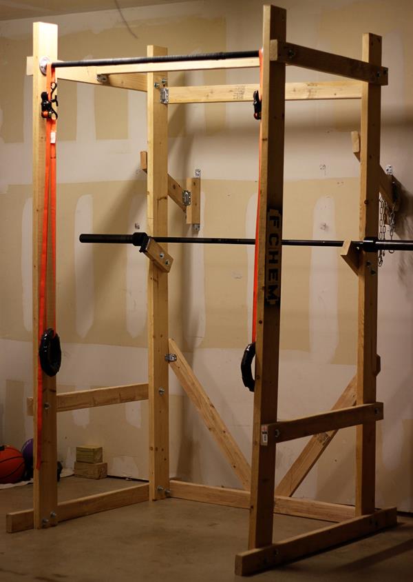 DIY wooden power weightlifting rack garage gym.