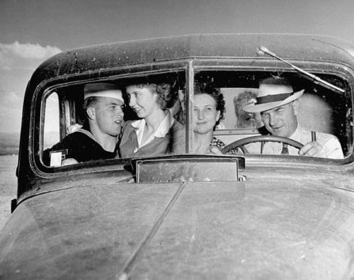 Vintage family in truck sailor with girlfriend and parents.