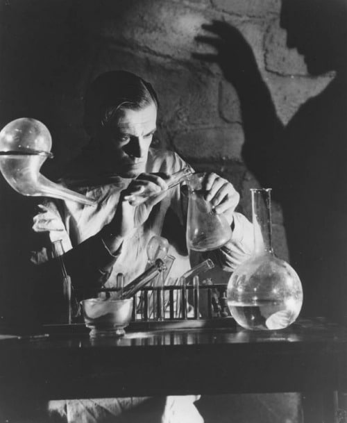 Vintage Dr. Victor Frankenstein in laboratory mid-20th century movie.