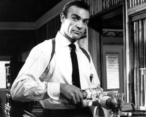 Sean Connery James bond pouring and drinking martini.