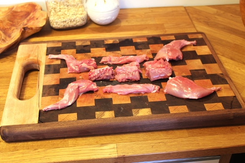 With the pelvis, neck, and ribs in the stock pot, above are the pieces left for cooking in any way you wish: 2 front legs, 3 loin sections, 2 belly meats, and 2 back legs.
