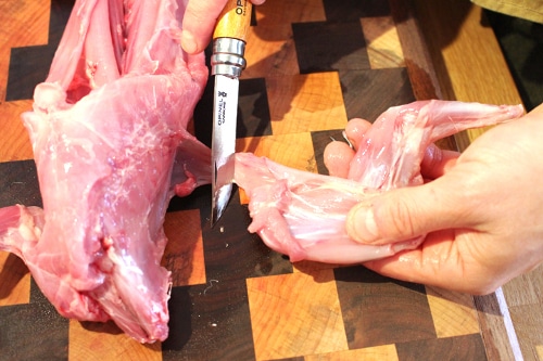 After the silver skin is removed, I focus on the front legs. They are not attached by bone to the body so it’s pretty simple. Cut close to the ribcage and remove as much meat as possible.
