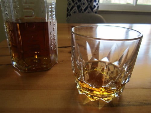 tin cup whiskey in old fashioned rocks glass