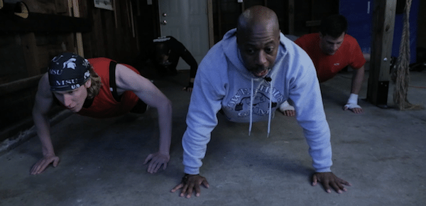 men in garage doing push-ups home fight club 