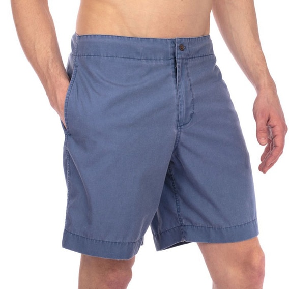 Man wearing a blue shorts swim suit.