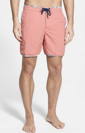 For a good compromise between very long trunks and a short square-cut suit, look for shorts with a 6-7 inseam. This length has been coming into style of late. Brett in fact recently traded his self-described Hawaiian "suburban dad" shorts for this pair.