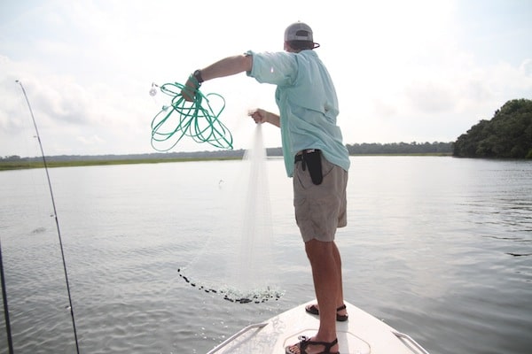 Angler Newman Lawrence prepares to cast for bait.