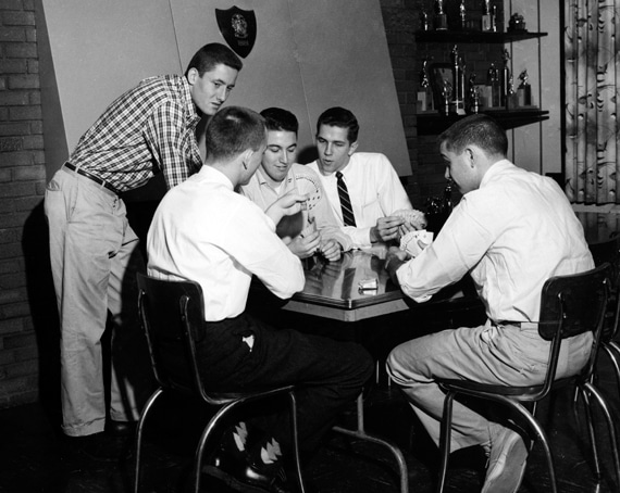 Vintage young college men playing cards. 