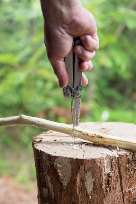 perforating cooking spit with leatherman tool