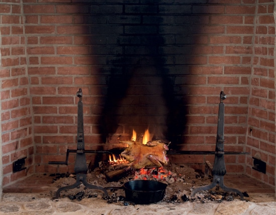 homemade spit roast in fireplace