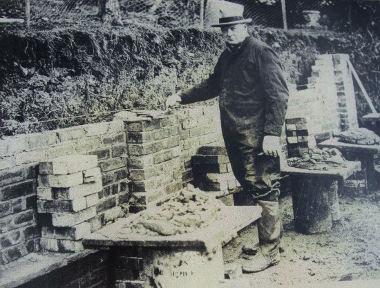 Churchill Standing Near the Brick Wall.