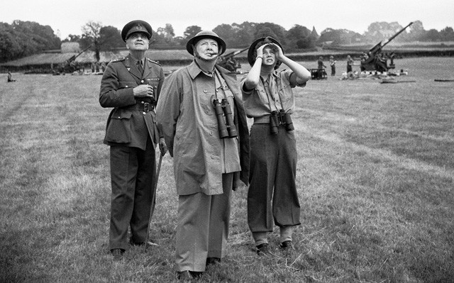 Winston Churchill in field watching Military drills. 