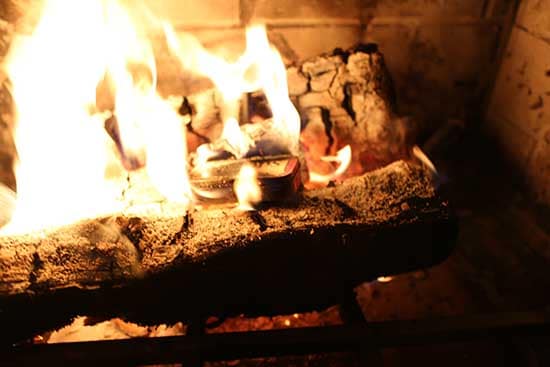 diy homemade char cloth firestarter altoids tin in fireplace