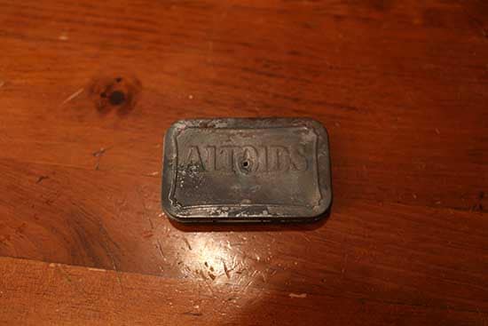burned altoids tin