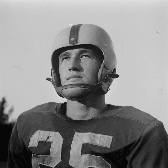 A rugby player wearing helmet in sport uniform.