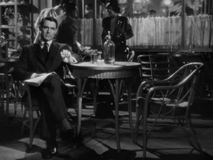 Vintage Man sitting in restaurant at dinner Table. 