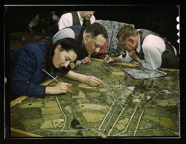 Vintage artists working on drawing roadmap. 