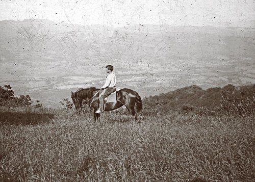 jack london riding horseback through field