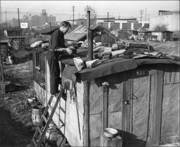 Vintage man on ladder repairing shed roof. 