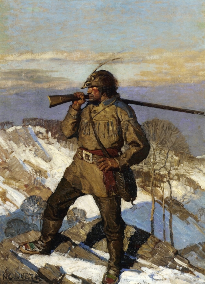 A soldier man carrying gun over shoulder on the top of mountain. 