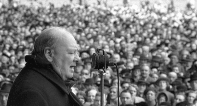 Winston churchill speaking to crowd.