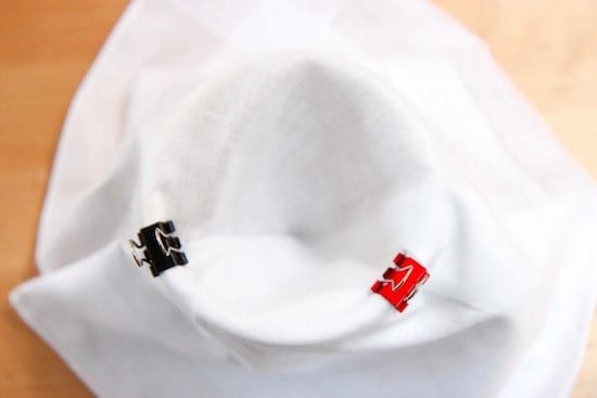 Step 2: Attach your handkerchief filter to a cup. Paper clips work best.