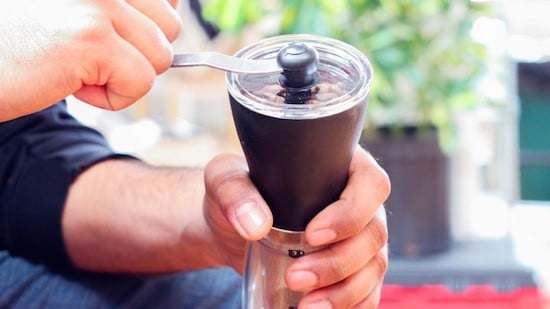 Step 3: Grind your coffee to a medium, sand-like grind. This is a great (and short) workout for your forearms and wrists. Switch hands half way if you are feeling ambidextrous. Pro tip: African beans are smaller and heavier than Central or South American or Asian beans. You can use fewer African beans (about 20% less) and still get the same strong cup of coffee.