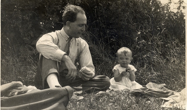 Vintage 1940s father picnic with baby.